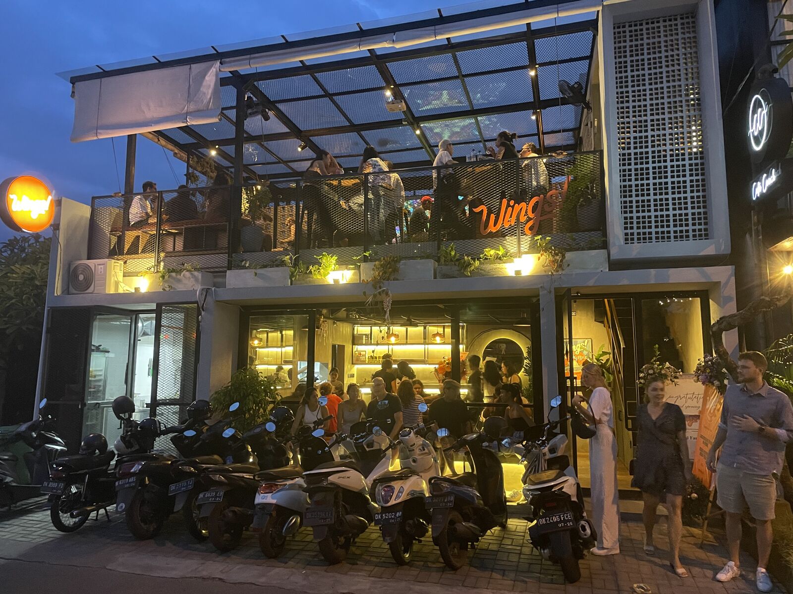 Wings Canggu storefront at night